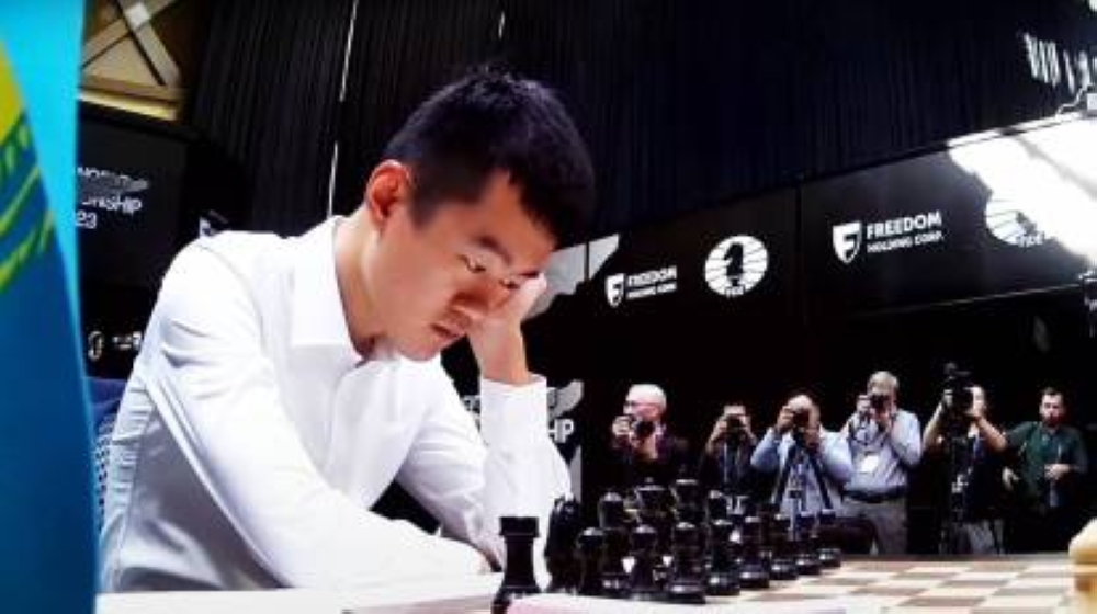 Ding Liren contemplates his tactics before the start of a World Chess Championship game against Ian Nepomniachtchi last year in Astana.