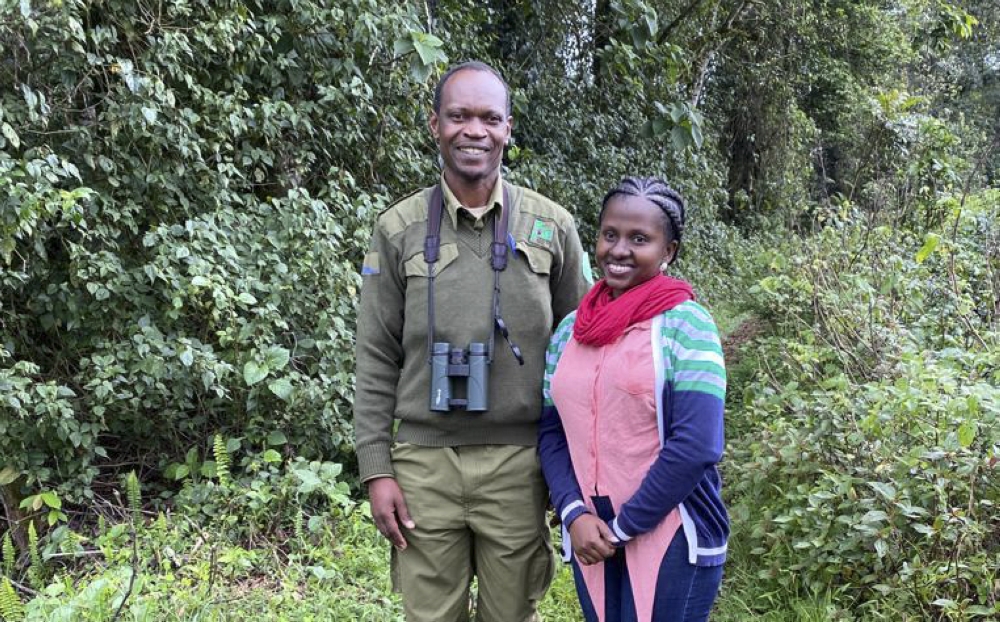 The writer posing for a photo with Claver Ntoyinkima, a ranger at Nyungwe National Park