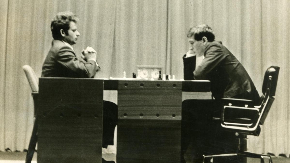 Catching the world’s attention: Boris Spassky, left, faces Bobby Fischer on the stage of Reykjavik’s Exhibition Hall on July 11, 1972. | Photo Credit: THE HINDU ARCHIVES