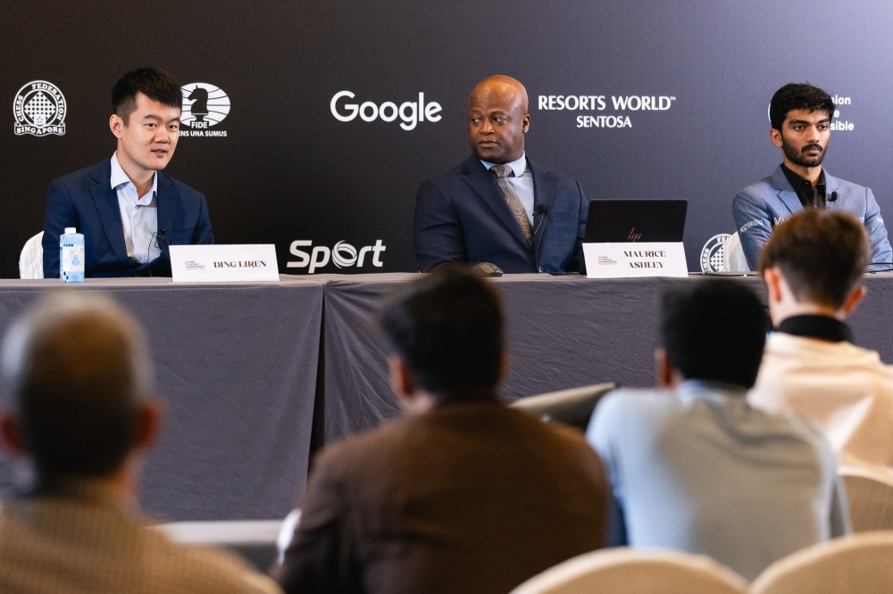 L-R: Reigning world champion Ding Liren, GM Maurice Ashley, the emcee and press conference host for the match, and GM Gukesh Dommaraju, at the Round 2 post-game press conference, on Tuesday, November 26. Courtesy of FIDE