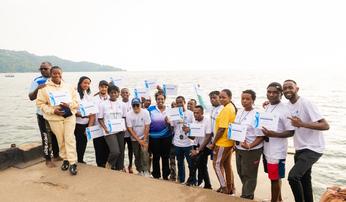 Swimming coaches pose for their certificates at the end of their coaching clinic at Lake Kivu beach in Rubavu District-courtesy