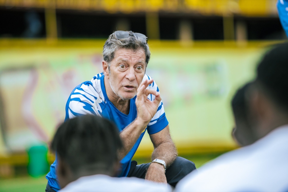 Rayon Sports head coach Robertinho Oliveira gives instructions to his players during a training session at Nzove football pitch. Courtesy