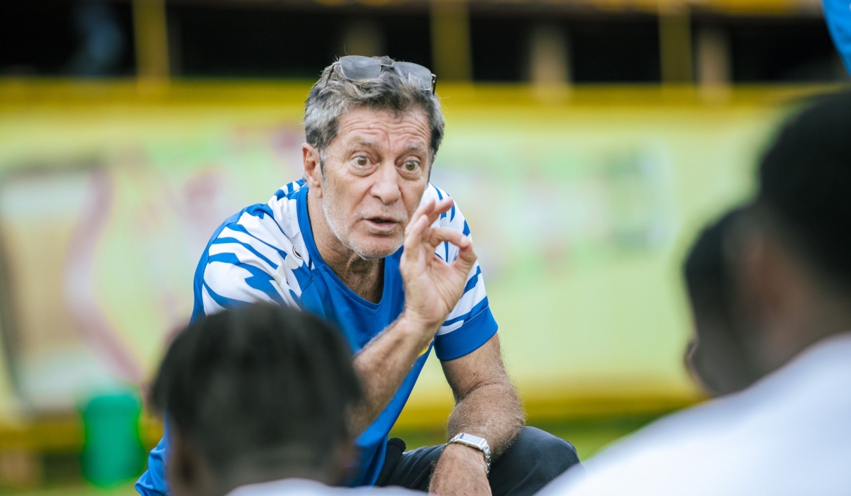 Rayon Sports head coach Robertinho Oliveira gives instructions to his players during a training session at Nzove football pitch. Courtesy