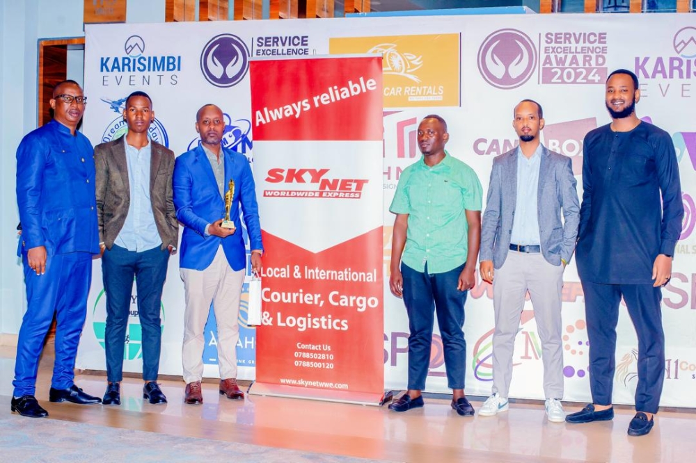 SkyNet’s team pose for a group photo after being honored as Courier Service Provider of the Year at the Service Excellence Awards on November 24 in Kigali.