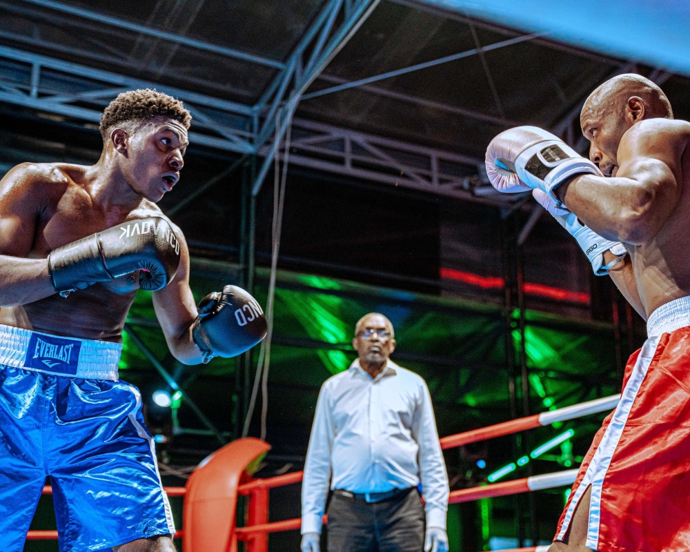 Two boxers go head to head during a past fight at Kigali Universe-Courtesy