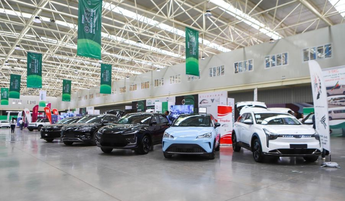 Exhibitors display electric vehicles at the Ethio-Green Mobility 2024 exhibition in Addis Ababa, capital of Ethiopia, Nov. 25, 2024. Ethiopia is hosting its first-ever green mobility exhibition as part of its commitment to reducing carbon emissions and promoting green transport solutions.
   TO GO WITH "Feature: Ethiopia hosts first-ever electric vehicle expo to advance green mobility" (Xinhua/Michael Tewelde)