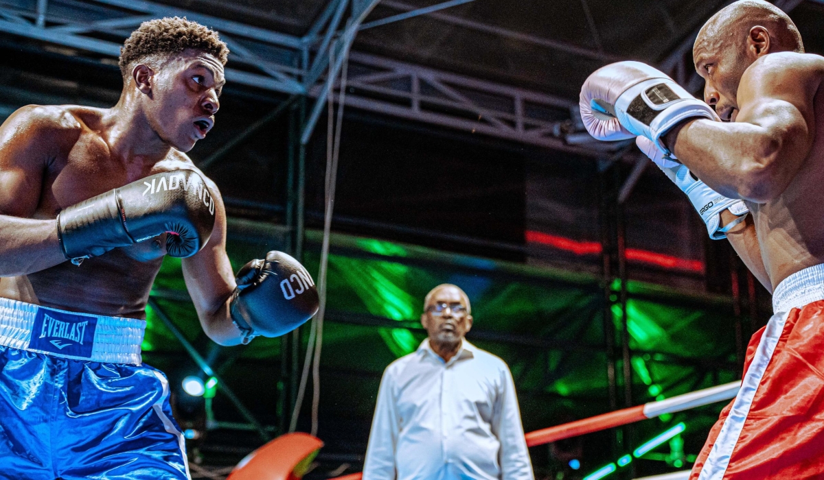 Two boxers go head to head during a past fight at Kigali Universe-Courtesy