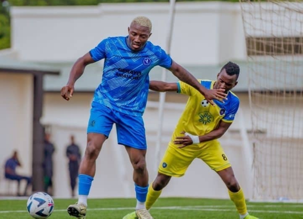 Police FC (Left) striker Elijah Ani shields the ball from Amagaju midfielder Emmanuel Tuyishime during the match.