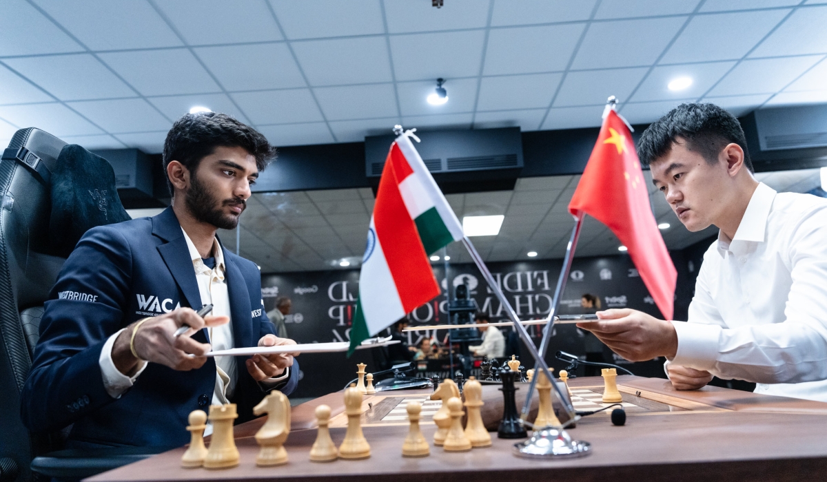 India’s GM Gukesh Dommaraju and China&#039;s GM Ding Liren exchange score sheets after Game 4 in the 2024 FIDE World Championship Match in Singapore ended in a 42-move draw after threefold repetition on Friday, November 29. Courtesy of FIDE