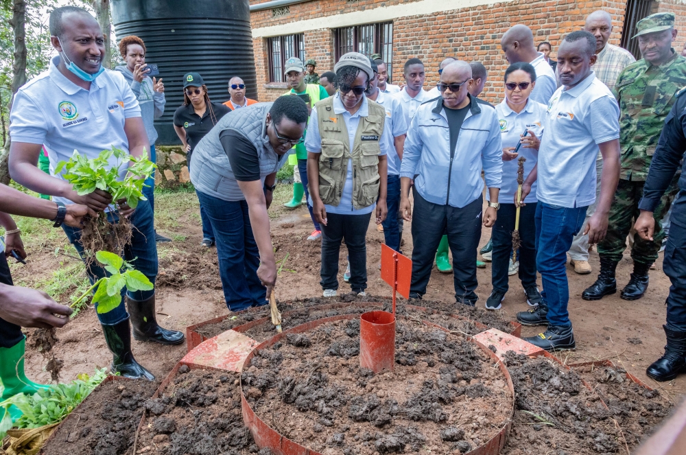 Solange Kayisire, Minister of State for Local Government(L) leads other participants during a kitchen garden installation in Karongi District on Saturday, November 30. All photos by Craish Bahizi