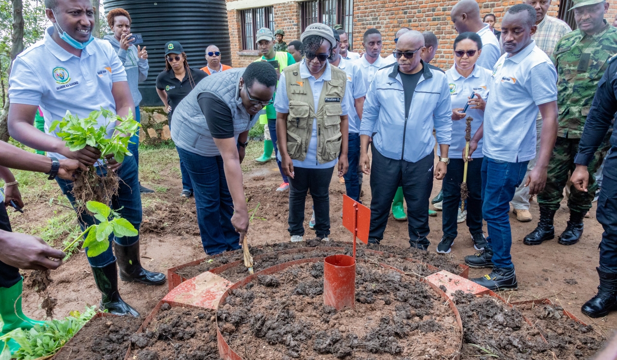 Solange Kayisire, Minister of State for Local Government(L) leads other participants during a kitchen garden installation in Karongi District on Saturday, November 30. All photos by Craish Bahizi