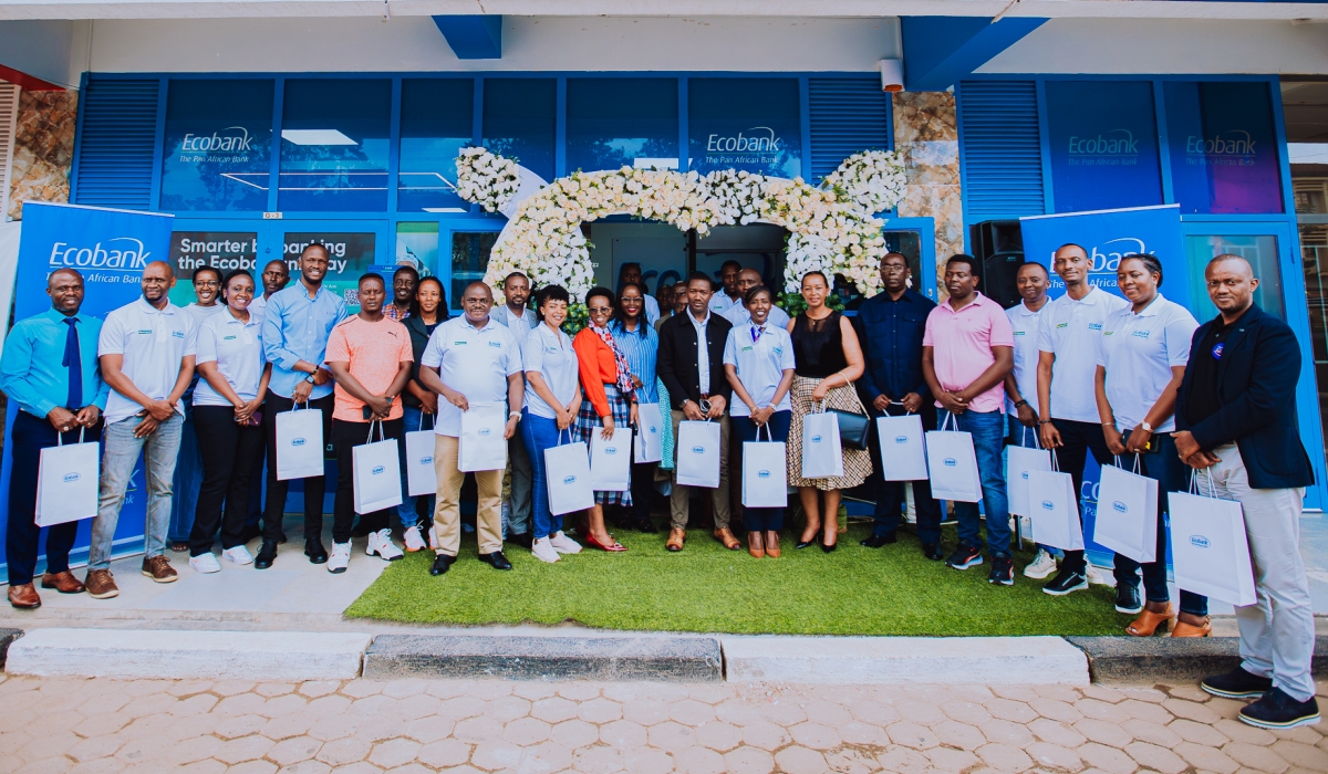 The bank clients and officials pose for a group photo at the opening ceremony. The new branch will enable Ecobank  to provide improved services to customers.