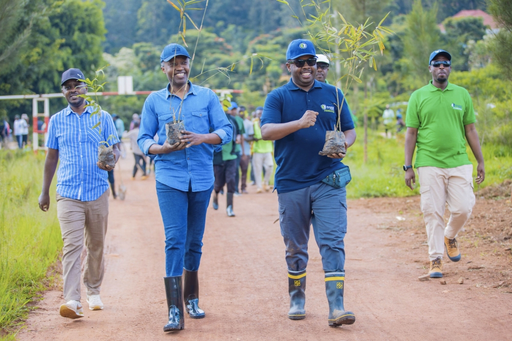 State Minister in the Ministry of Infrastructure, Olivier Kabera and City of Kigali Mayor Samuel Dusingiyumva during a tree planting exercise. Courtesy