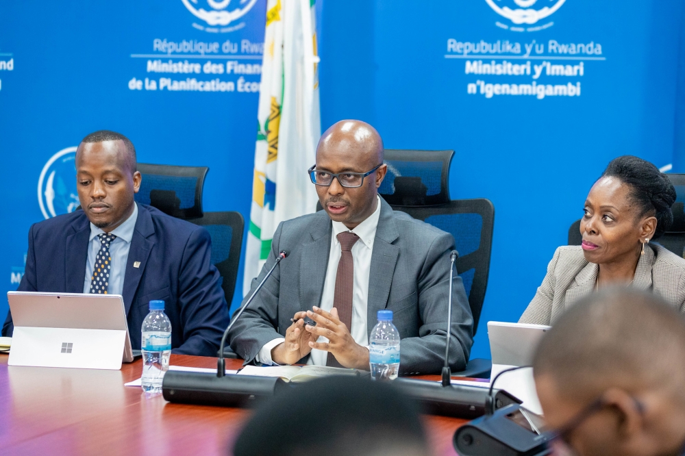 Minister of Finance and Economic Planning Yusuf Murangwa addresses journalists about the new reforms, as Minister of Public Service and Labour Christine Nkulikiyinka and  RSSB Chief Executive Officer Regis Rugemanshuro look on, on Monday, December 2. Photos by Craish Bahizi