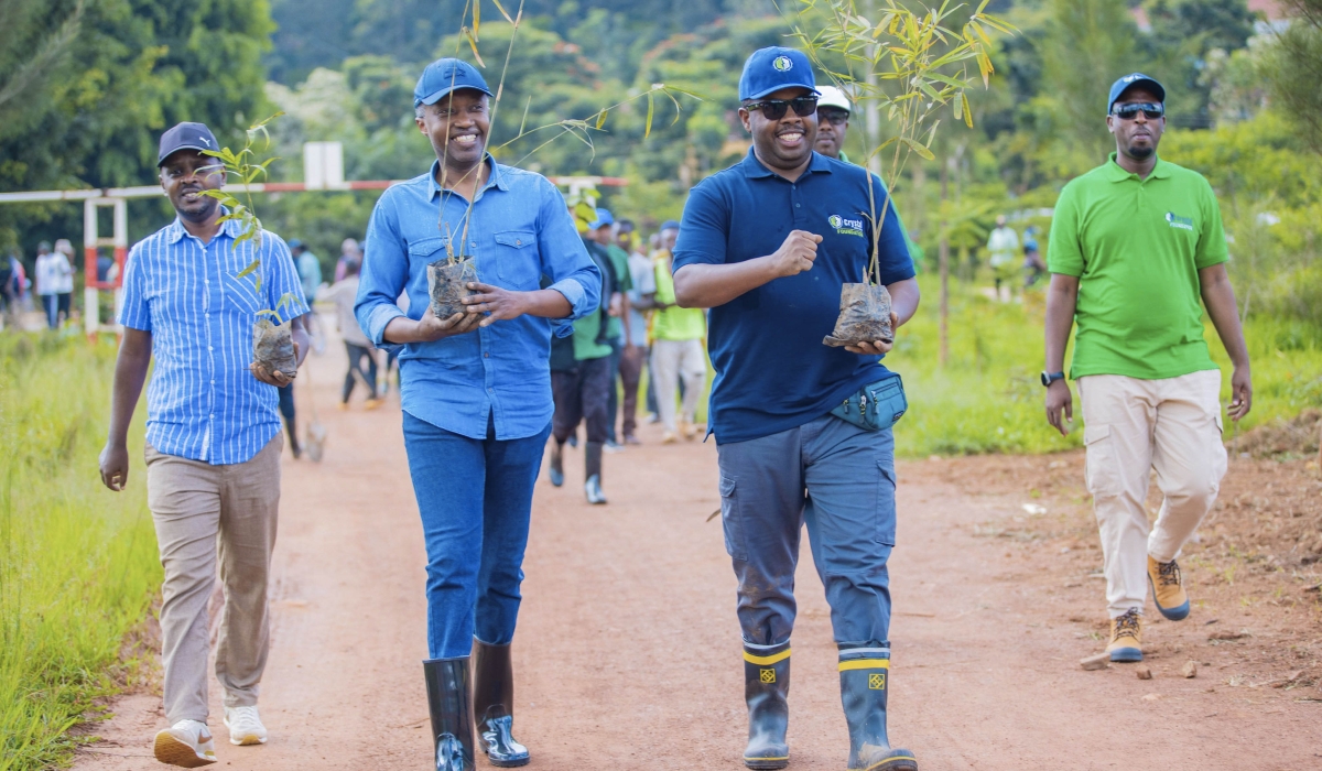 State Minister in the Ministry of Infrastructure, Olivier Kabera and City of Kigali Mayor Samuel Dusingiyumva during a tree planting exercise. Courtesy