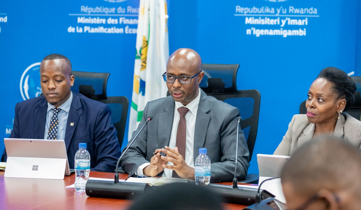 Minister of Finance and Economic Planning Yusuf Murangwa addresses journalists about the new reforms, as Minister of Public Service and Labour Christine Nkulikiyinka and  RSSB Chief Executive Officer Regis Rugemanshuro look on, on Monday, December 2. Photos by Craish Bahizi