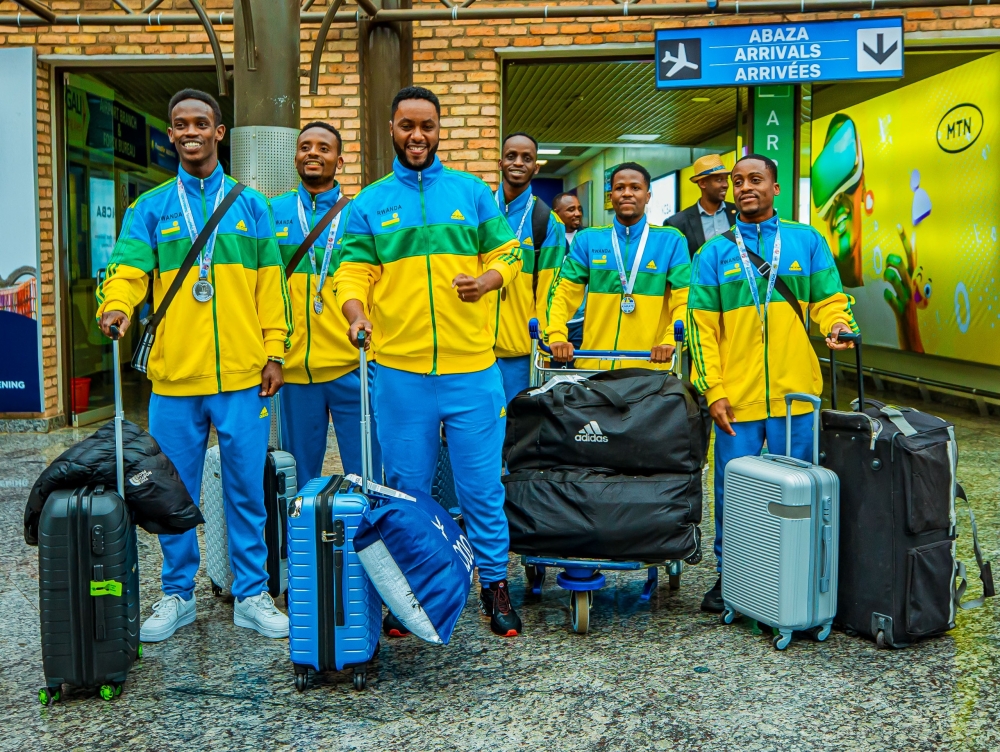 Members of the national karate team on arrival at Kigali International Airport, on Tuesday, December 3. The squad of five players returned home with three medals, including silver, from the 11th Commonwealth Karate Championships in Durban, South Africa-courtesy photos