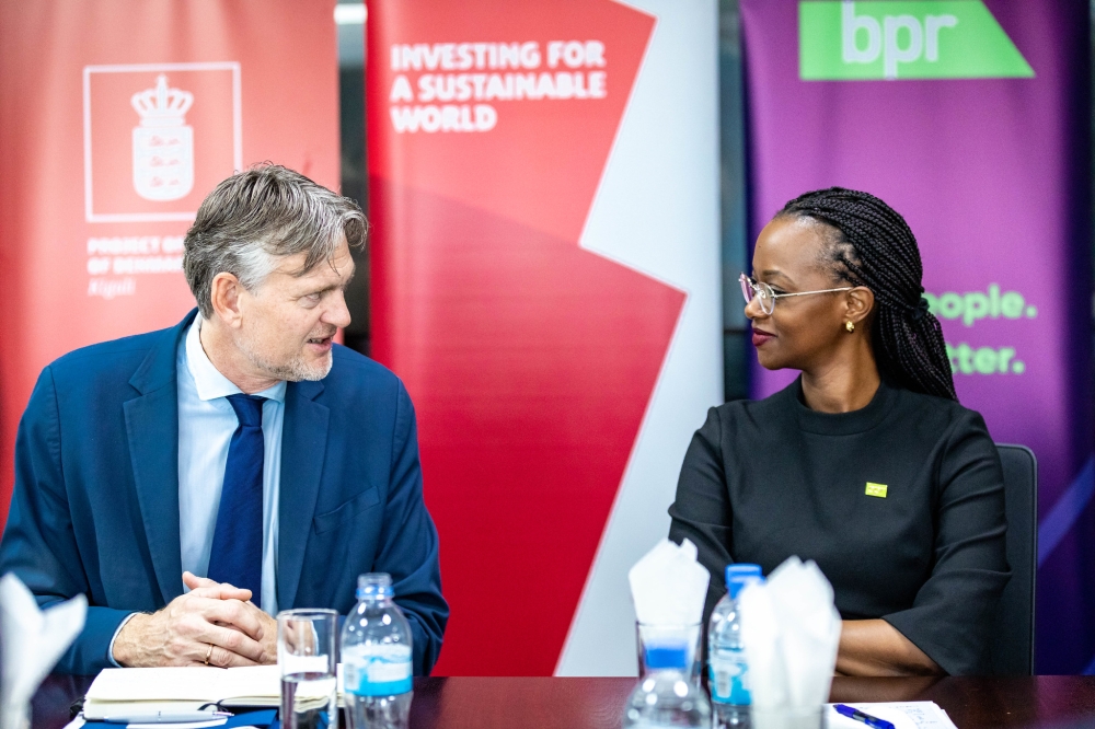 Patience Mutesi, Managing Director of BPR Bank, interacts with Ole Thonke, Undersecretary for Development Policy in Denmark during the launch on Tuesday, December 3. All photos by Craish Bahizi