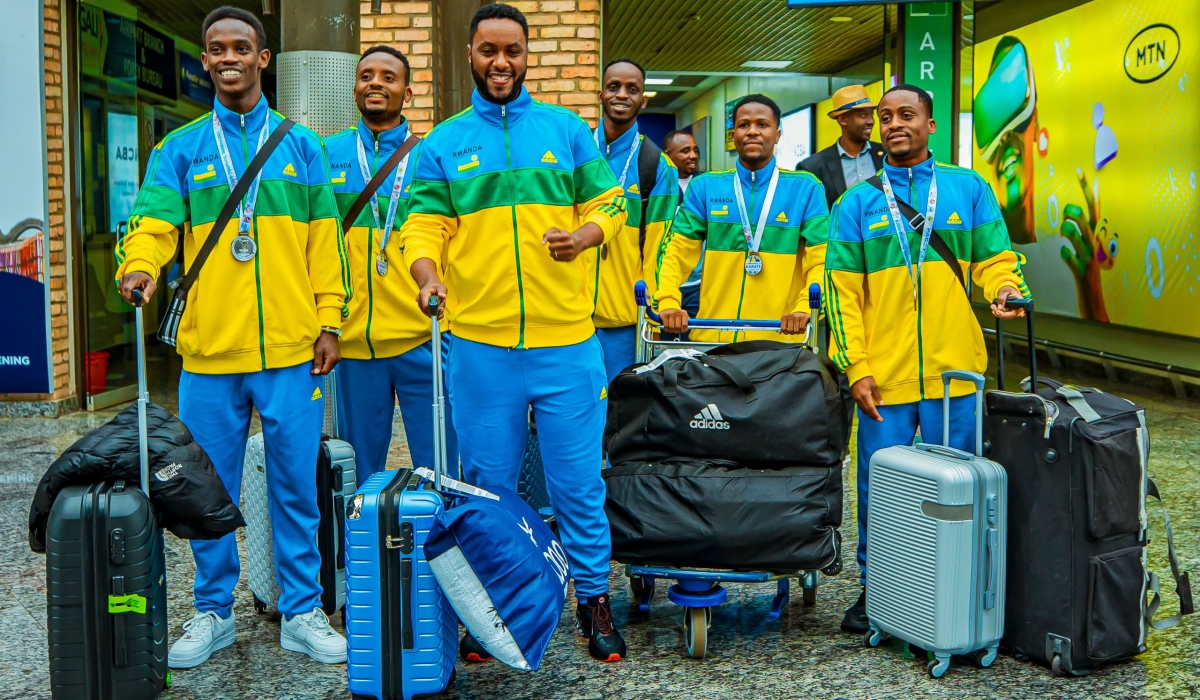 Members of the national karate team on arrival at Kigali International Airport, on Tuesday, December 3. The squad of five players returned home with three medals, including silver, from the 11th Commonwealth Karate Championships in Durban, South Africa-courtesy photos