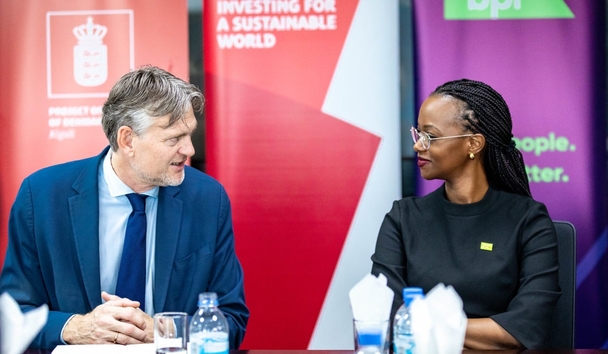 Patience Mutesi, Managing Director of BPR Bank, interacts with Ole Thonke, Undersecretary for Development Policy in Denmark during the launch on Tuesday, December 3. All photos by Craish Bahizi