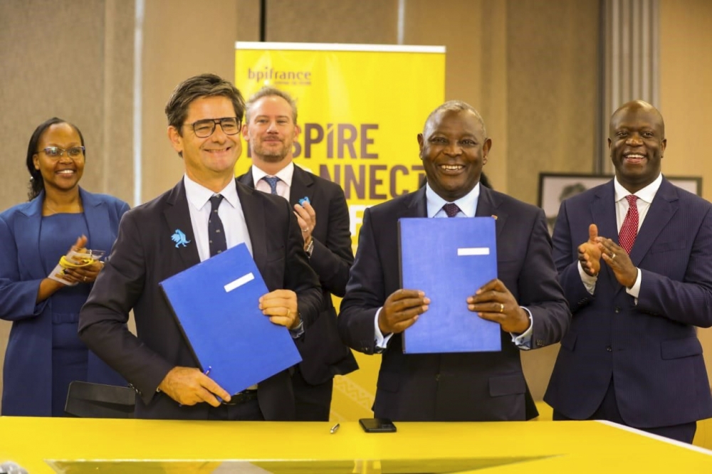 (L-R, front row) Equity Group Managing Director and CEO Dr. James Mwangi and BPI France CEO Nicolas Dufourcq display the MoU between Equity and BPI France. Looking on in second row (L-R) is Managing Partner ALN Kenya, Rosa Nduati-Mutero, the French Ambassador to Kenya Arnaud Suquet and the Principal Secretary for Investment, Trade and Industry Alfred K’Ombudo.