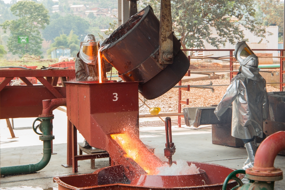 Workers melting tin at LuNa Smelter Ltd in Gasabo District. Photo by Sam Ngendahimana