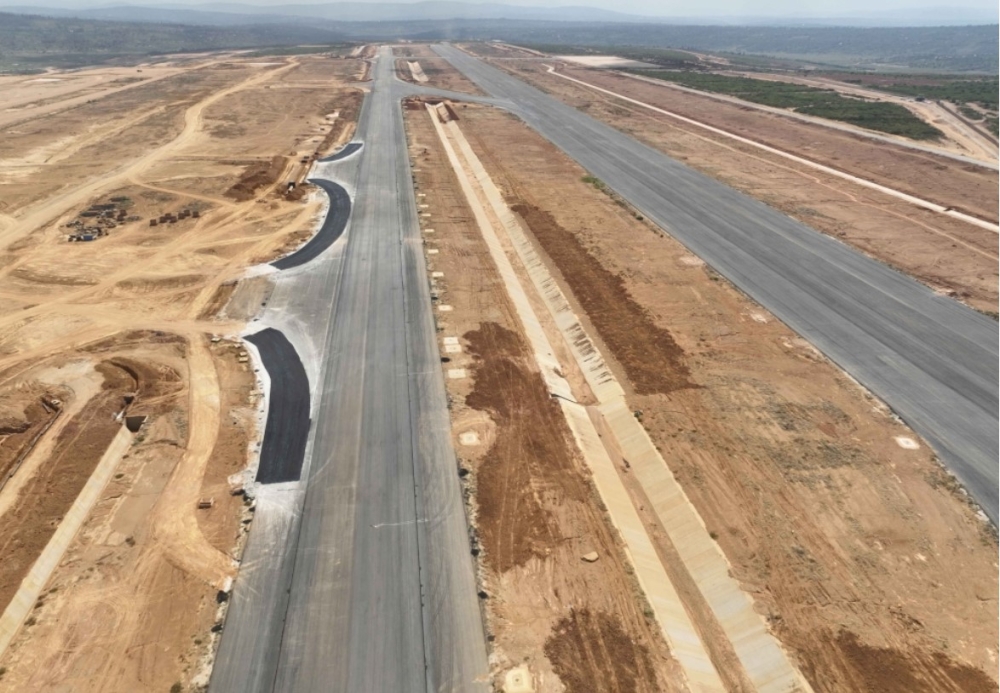 A view of the ongoing construction of the new runway, taxiway, and drainage channel at the airport construction that is underway in Bugesera District. According to Afreximbank’s Industry Outlook report, Rwanda&#039;s construction industry is valued at an estimated $1.3 billion in 2024, with projections to reach $1.4 billion by 2025. Photo: Courtesy