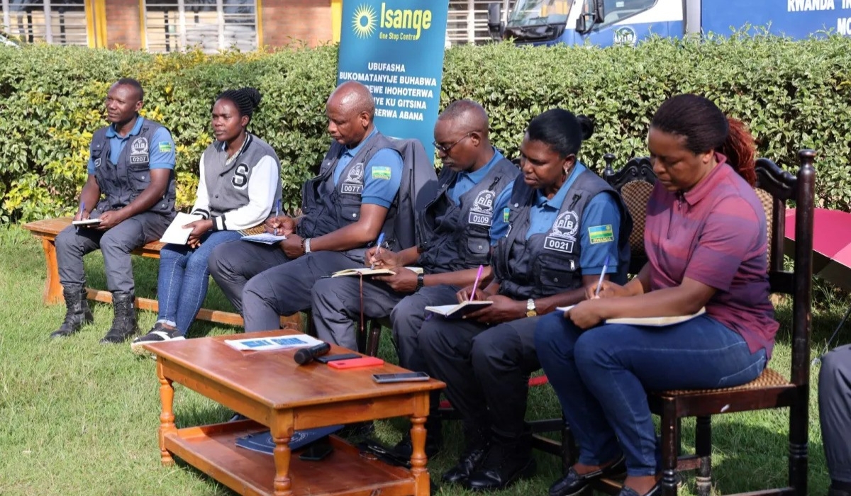 Rwanda Investigation Bureau personnel and local officials engage with residents in Gakenke District during a meeting to raise awareness about gender-based violence. (PhotoCourtesy).