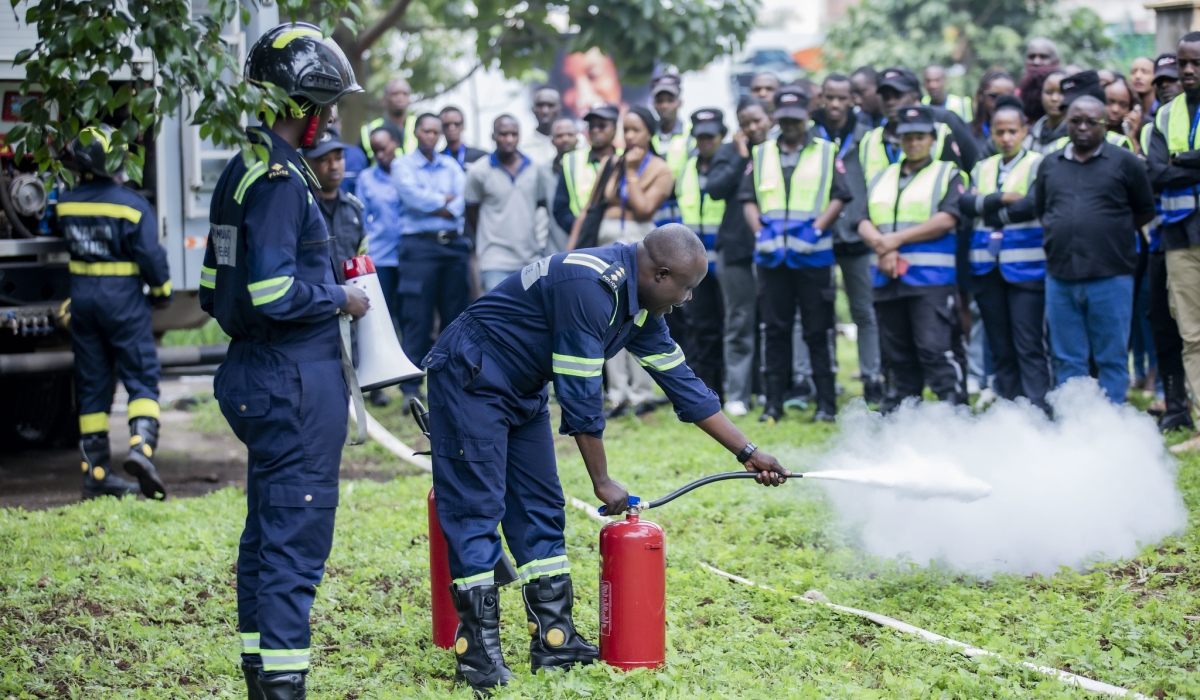 I&M Bank employees, customers, and nine tenants follow instructions on how to deal with fire outbreak during drills at the bank headquarters on Friday, December 7. All photos by   Emmanuel Dushimimana