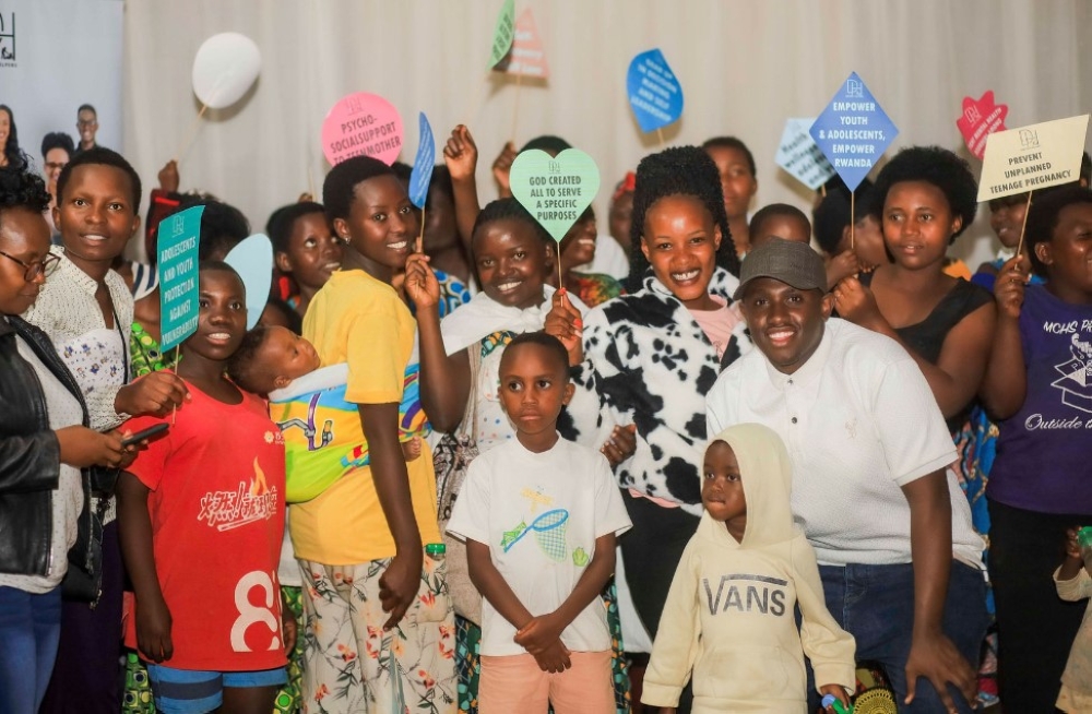 Beneficiaries pose for a group photo at the event in Ndera Sector