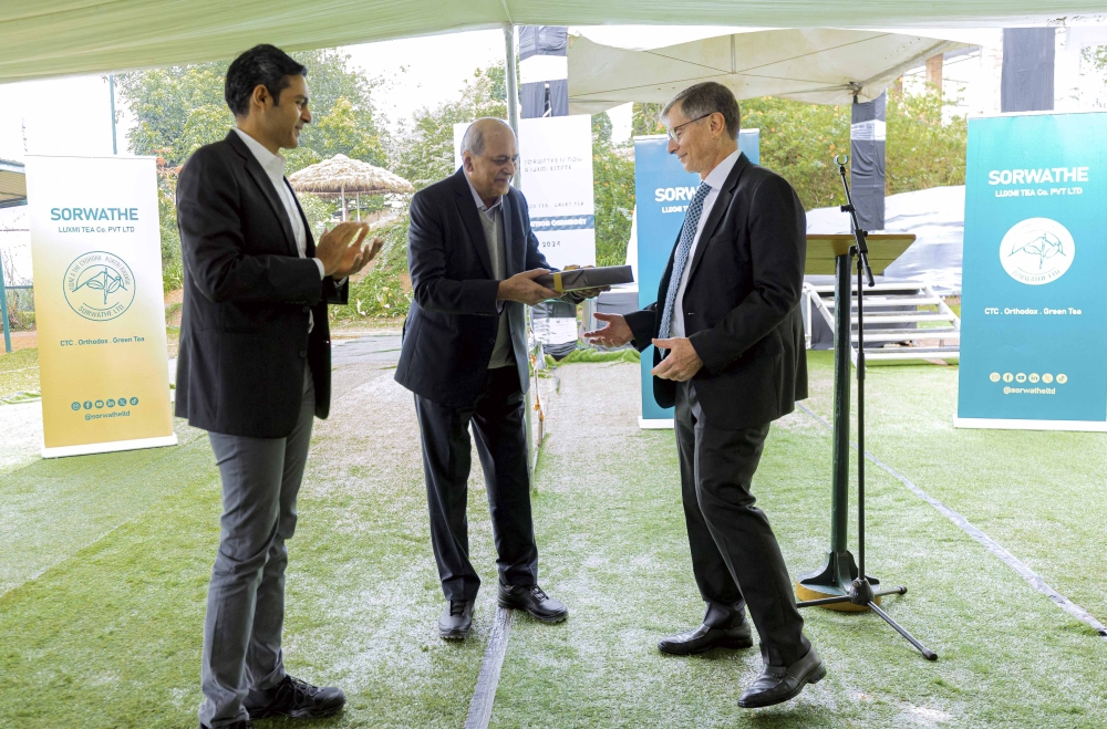 (L-R) Rudra Chatterjee, Chairman of Silverback Tea Company and Managing Director of SORWATE LUXIMI TEA Co. PVT LTD, his  Father Dipankar Chatterjee, Chairman of Luxmi Tea Co. Pvt. Ltd and Andrew Wertheim, Chairman at the handover ceremony at Sorwathe Ltd in Kinihira Sector, Rulindo District, Northern Province on December 5. Courtesy