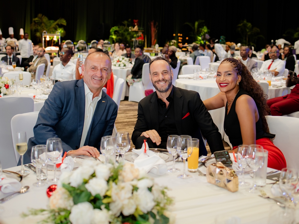 Rob Kucera, District Director for Radisson Hotels East Africa and Complex General Manager of Radisson Blu and Kigali Convention Centre (R) and delegates at the event. Radisson Blu Hotel & Convention Centre, Kigali, celebrated its annual appreciation cocktail and dinner on December 6. Photos by Craish Bahizi