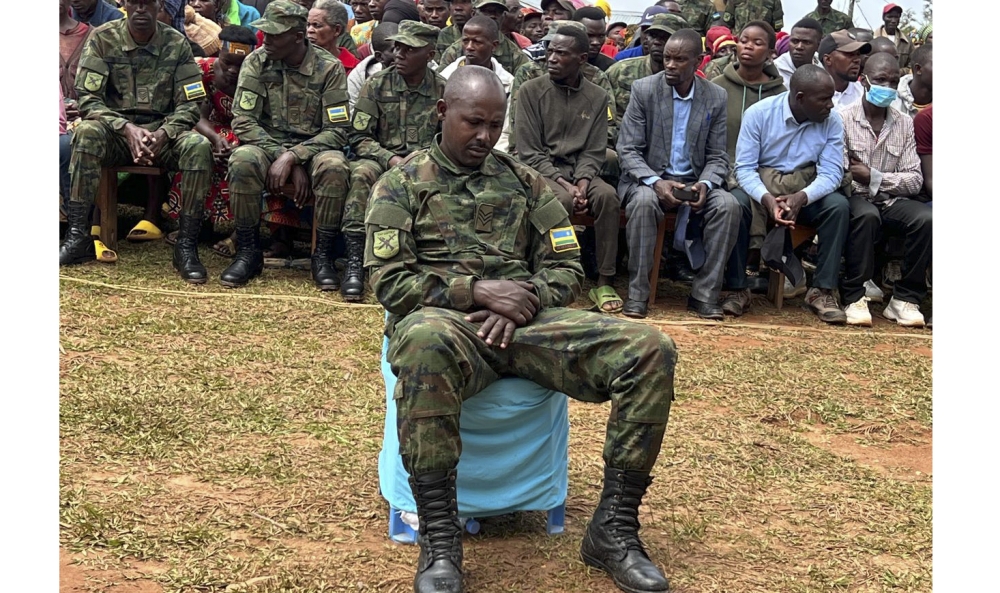 Sergeant Gervais Minani was found guilty of premediated murder of five civilians in Nyamasheke District. The convict (in the foreground) was seen in public for the first time since committing the offence, during  a public hearing in Nyamasheke last week. Courtesy