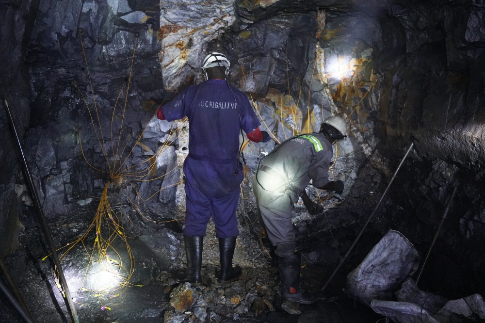 Miners inside a tunnel at Burera based mining site. Around 75,000 workers in the mining sector need to get the skills and qualification necessary to work in mines. Photo by Craish Bahizi