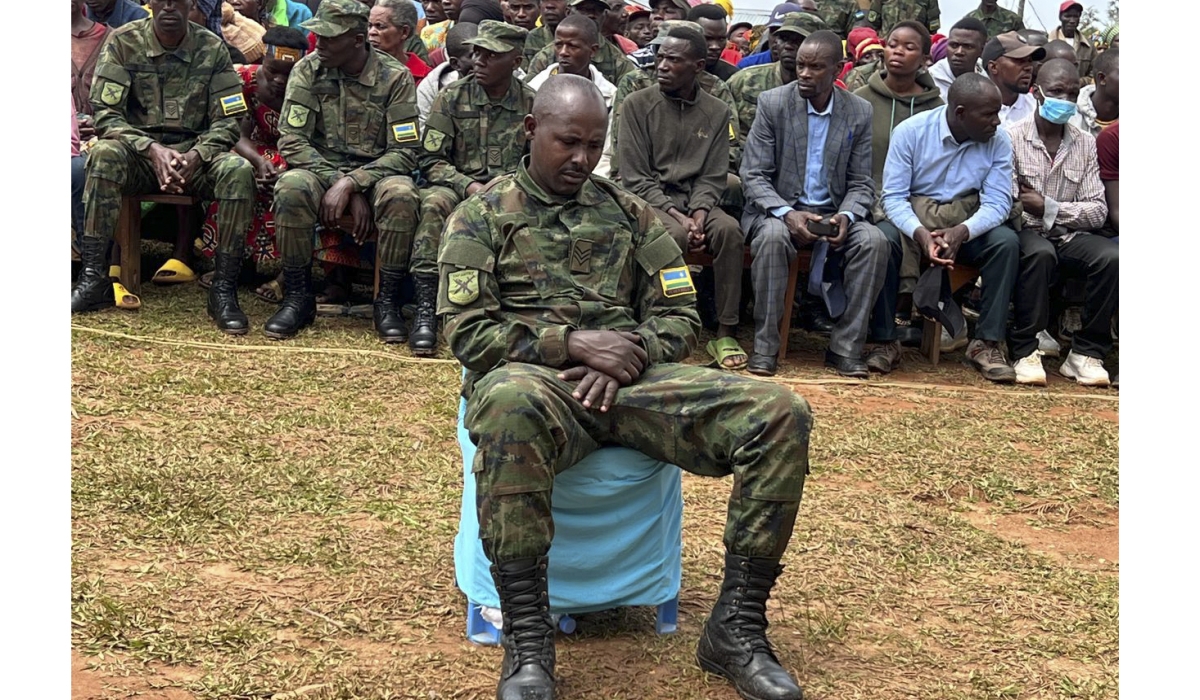 Sergeant Gervais Minani was found guilty of premediated murder of five civilians in Nyamasheke District. The convict (in the foreground) was seen in public for the first time since committing the offence, during  a public hearing in Nyamasheke last week. Courtesy