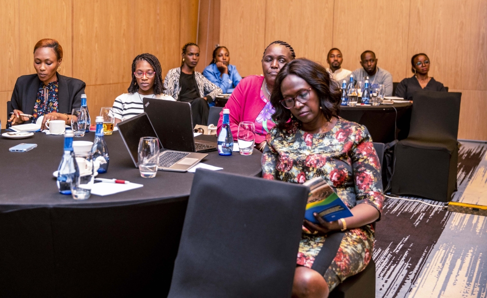 Delegates follow a panel discussion at the ceremony