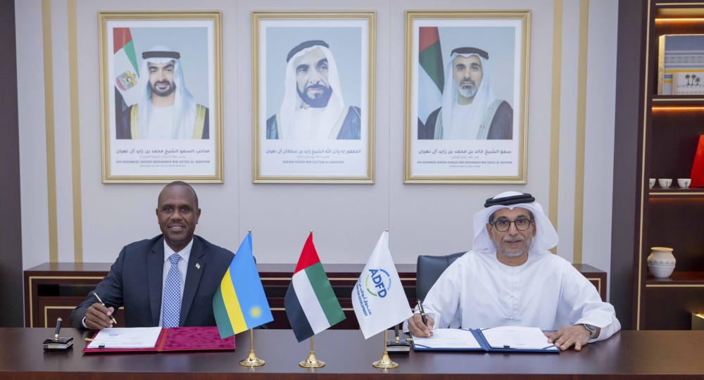 John Mirenge, the Ambassador of Rwanda to the UAE and Mohamed Saif Al Suwaidi, the Director General of Abu Dhabi Fund for Development sign the agreement in UAE.