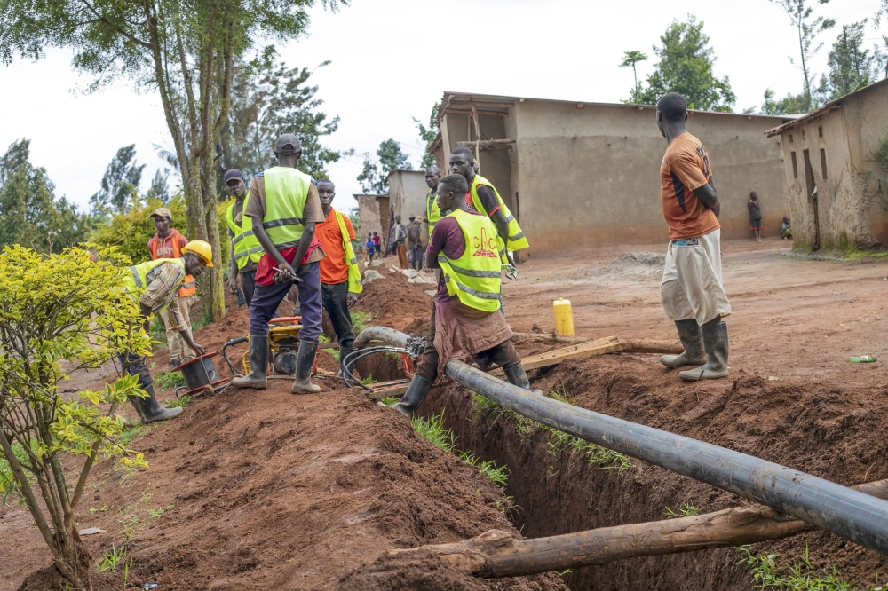 Workers install water pipelines in water supply projects that will enable the distribution of clean water to remote areas in Gatsibo.