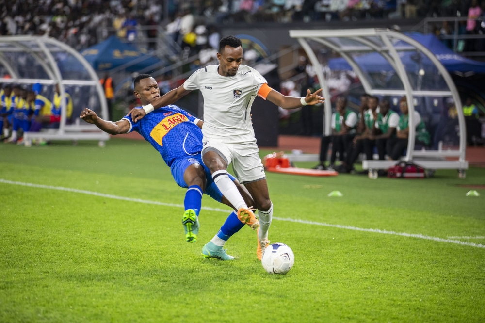 APR FC captain Jean Claude Niyomugabo win the ball against Rayon Sports player during a goalless draw at Amahoro stadium on December 7. Emmanuel Dushimimana