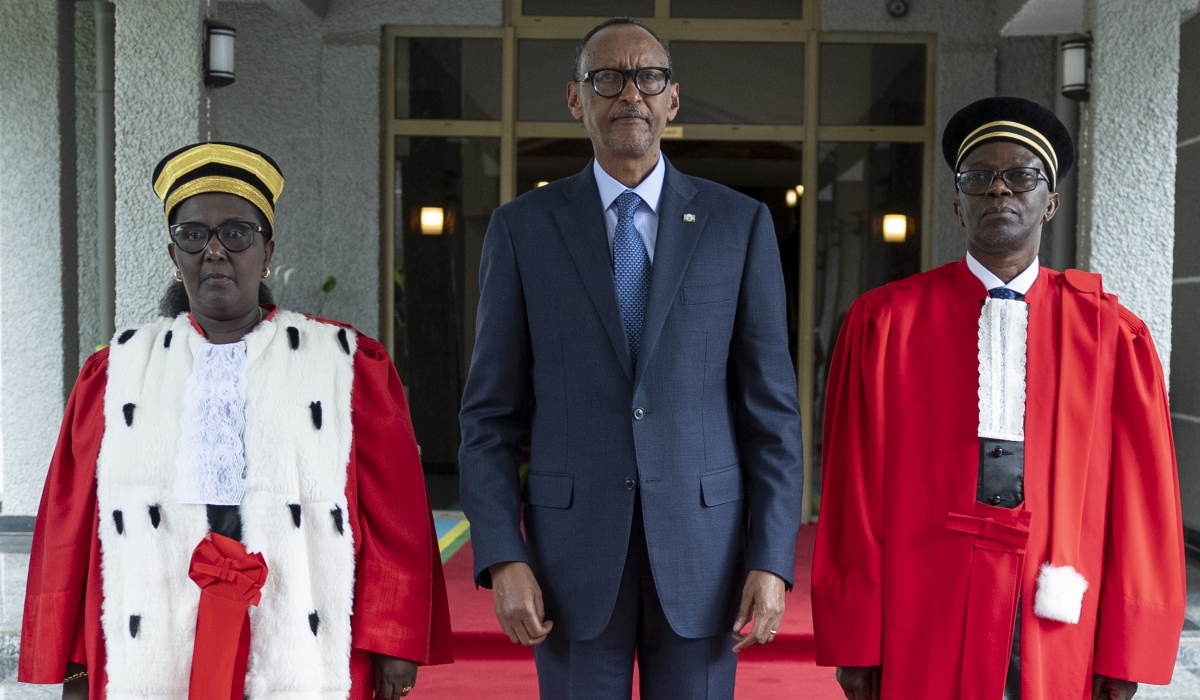 President Paul Kagame poses with new Chief Justice Domitilla Mukantaganzwa and her deputy Alphonse Hitiyaremye at the swearing-in ceremony in Kigali on Thursday, December 12. In his remarks, Kagame tasked the new Chief Justice to dispense justice without exception. Photos by Emmanuel Dushimimana