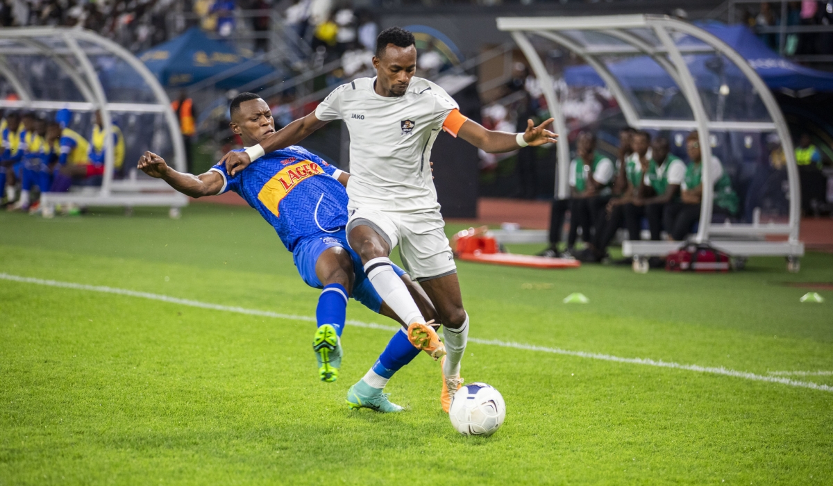 APR FC captain Jean Claude Niyomugabo win the ball against Rayon Sports player during a goalless draw at Amahoro stadium on December 7. Emmanuel Dushimimana