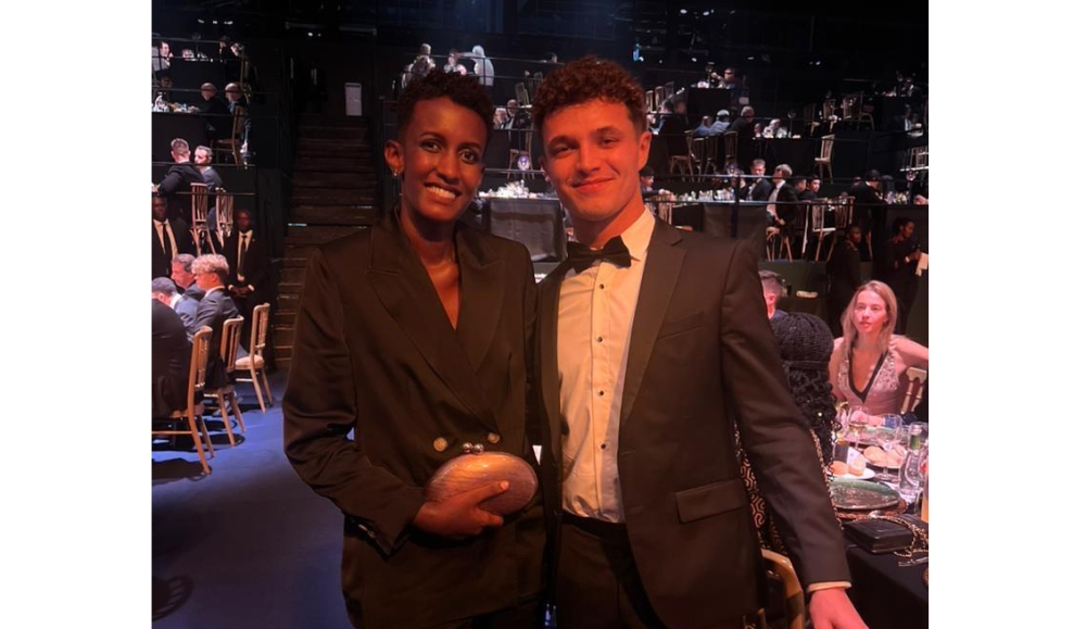 Rwandan Rally driver Queen Kalimpinya poses for a photo with British Formula One star Lando Norris-courtesy