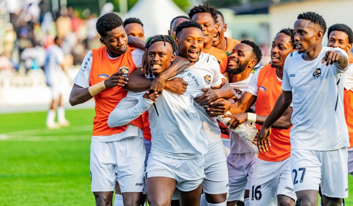 APR FC players crowd Alain Bacca Kwitonda in celebration of his screamer that completed club&#039;s 4-2  comeback against Mukura VS at Kigali Pele Stadium on Saturday-courtesy