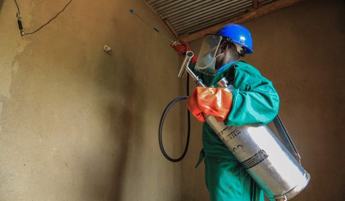 A health worker carries out residual mosquito spraying in Mugina, Kamonyi District. (File Photo)