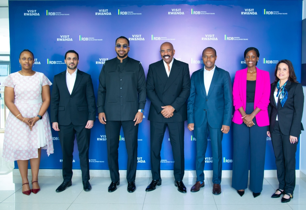 Both delegations pose for a group photo at the signing ceremony in Kigali