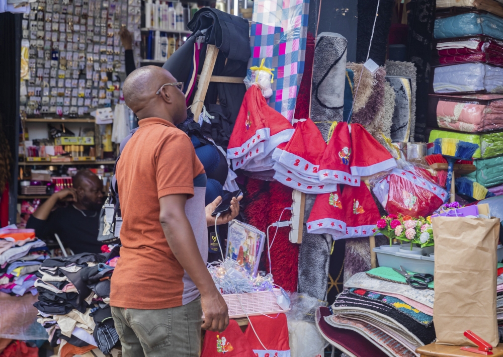 A client shopping some items for festive season at Kigali Business District in Nyarugenge. Photo by Craish Bahizi