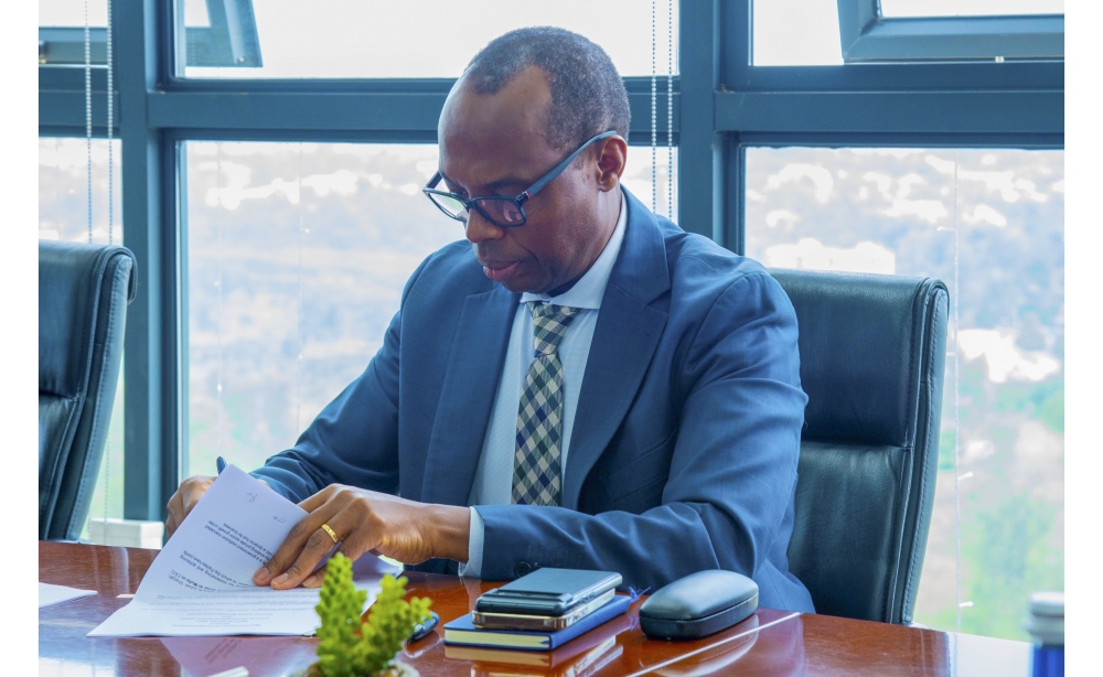 Rwanda Development Board CEO Francis Gatare  signs the agreement in Kigali on Monday, December 16. Courtesy