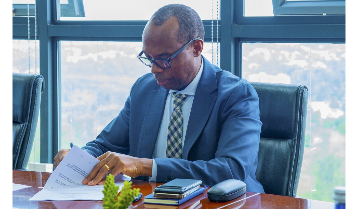 Rwanda Development Board CEO Francis Gatare  signs the agreement in Kigali on Monday, December 16. Courtesy