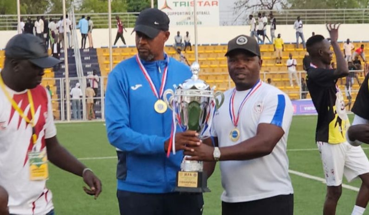 Jamus FC head coach Mbungo lifts the trophy with his assistant coach Godfrey Oduor-courtesy