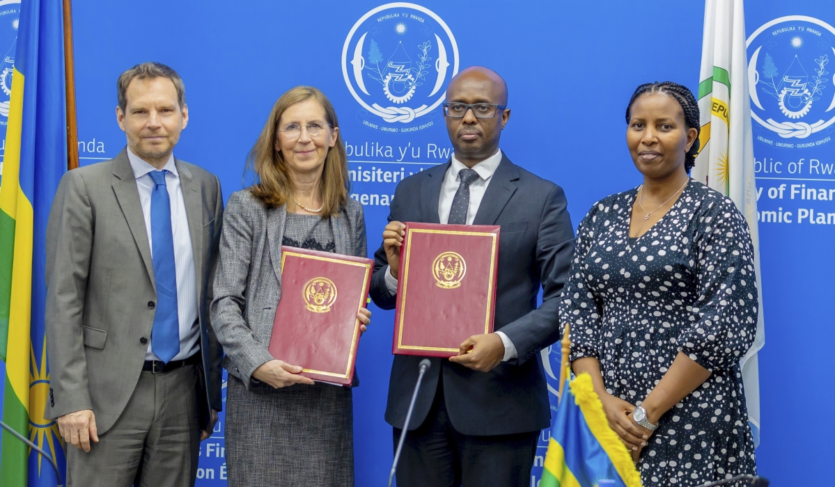 (L-R) Jochen Saleth, German Development Bank KfW Country Director, the German Ambassador to Rwanda, Heike Uta Dettmann, Yusuf Murangwa, the Minister of Finance and Economic Planning and Juliet Kabera, the Director General of the Rwanda Environment Management Authority, pose for a photo at the  signing ceremony  in Kigali on Wednesday, December 18. Courtesy